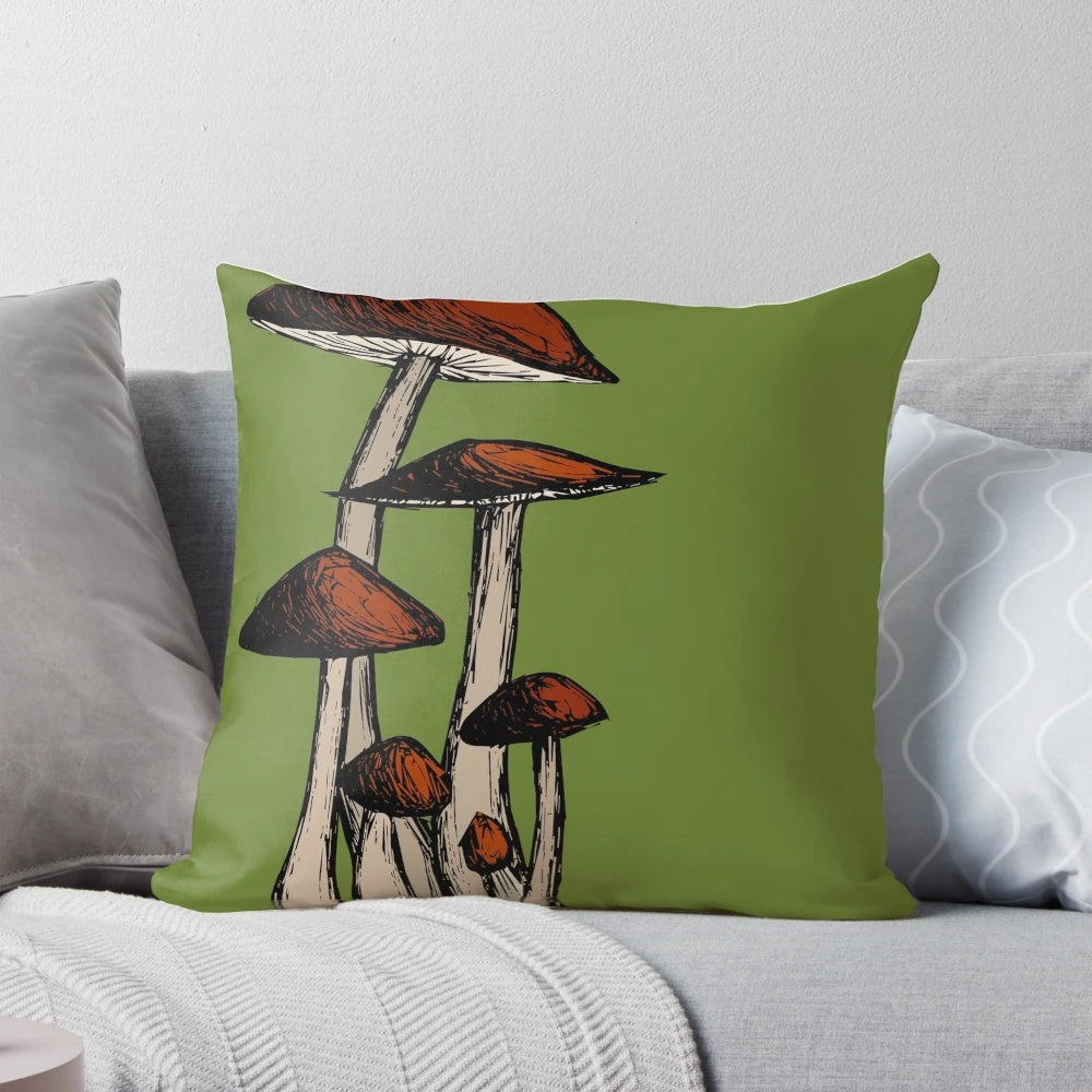 Decorative pillow featuring a sketch-style illustration of a cluster of mushrooms in various shades of red, brown, and green.