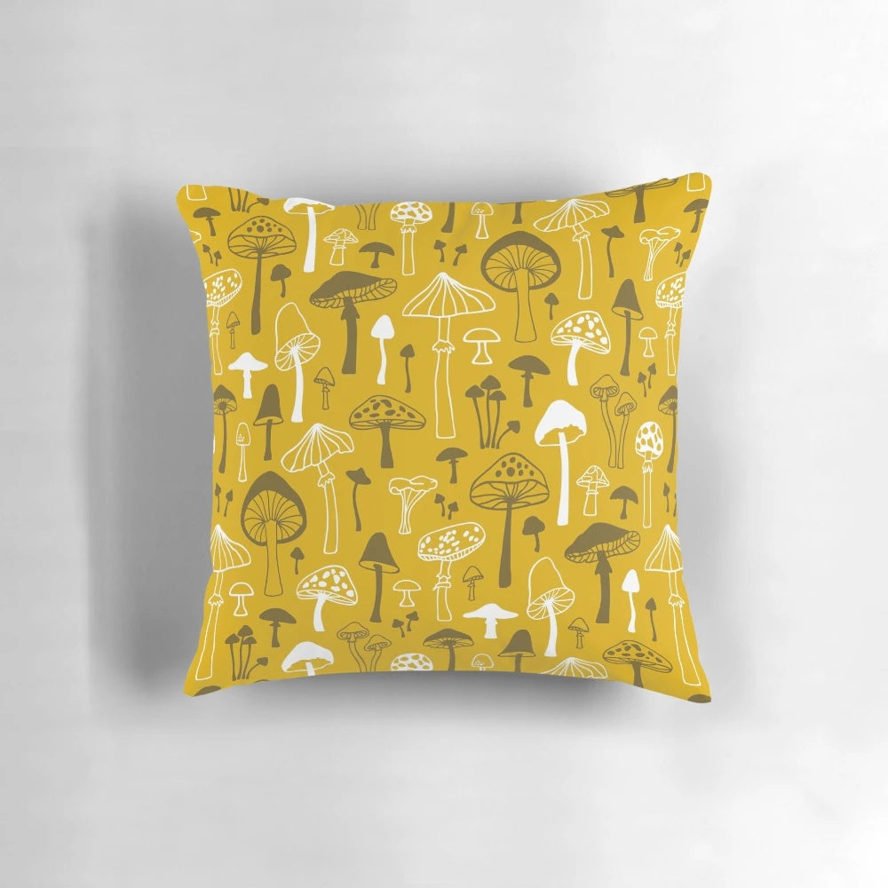 Illustrated mushroom design on a gray and white pillow, creating a nature-inspired, botanical look for your home.