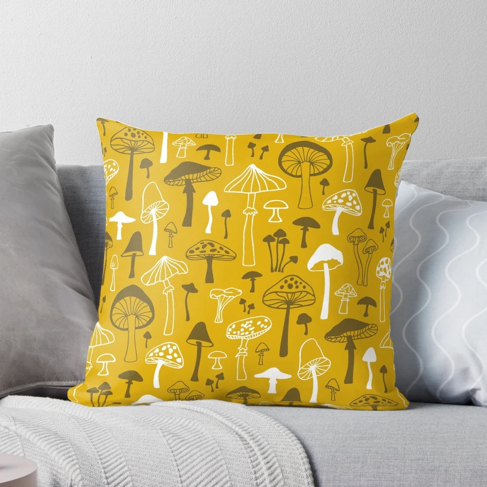 Illustrated mushroom design on a gray and white pillow, creating a nature-inspired, botanical look for your home.