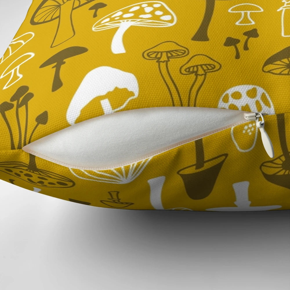 Illustrated mushroom design on a gray and white pillow, creating a nature-inspired, botanical look for your home.