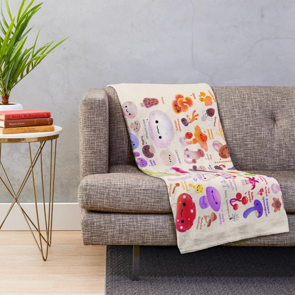 Closeup of a plush, soft, and fluffy mushroom-themed blanket in autumnal colors
