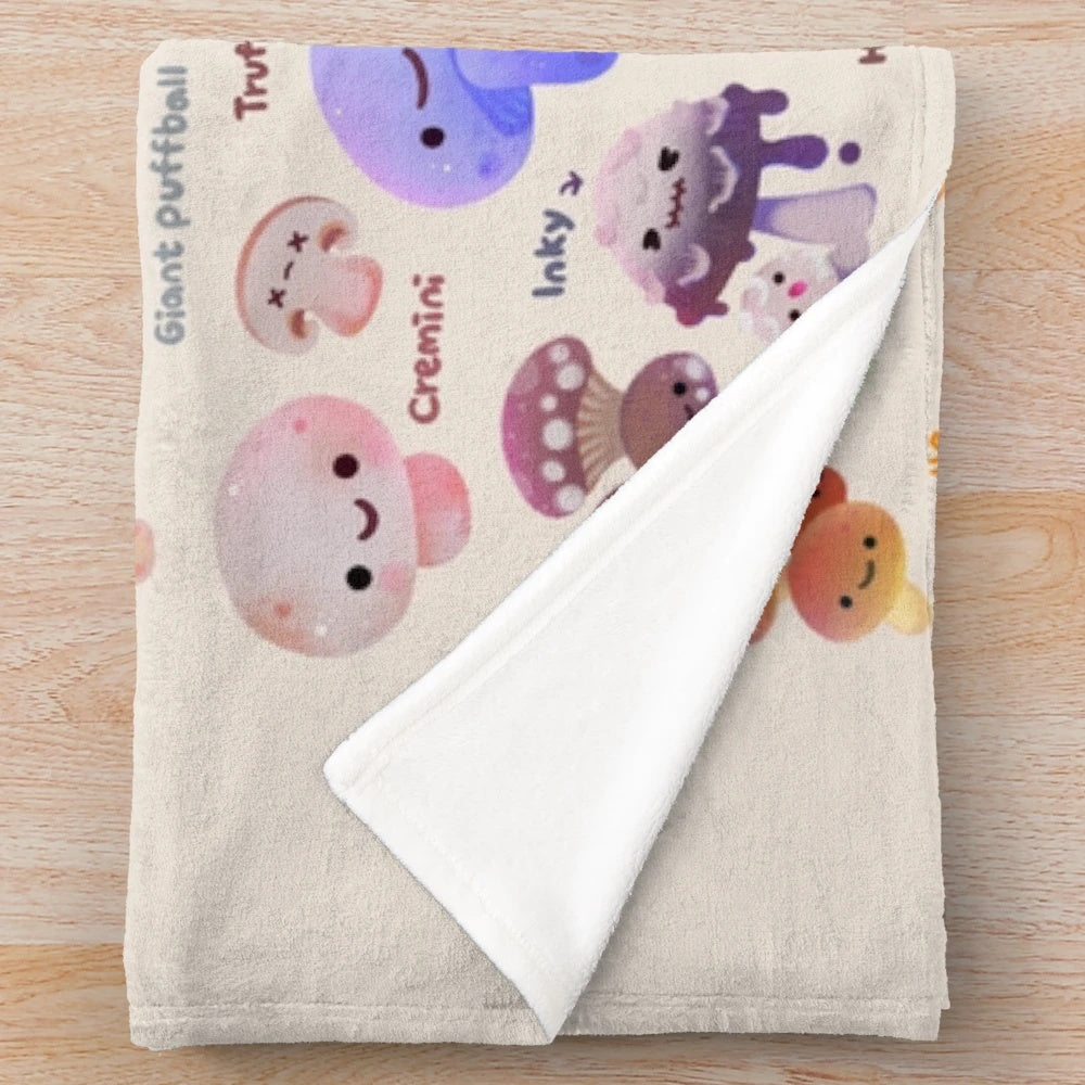 Closeup of a plush, soft, and fluffy mushroom-themed blanket in autumnal colors
