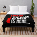 Soft plush blanket featuring a bass player design for music enthusiasts
