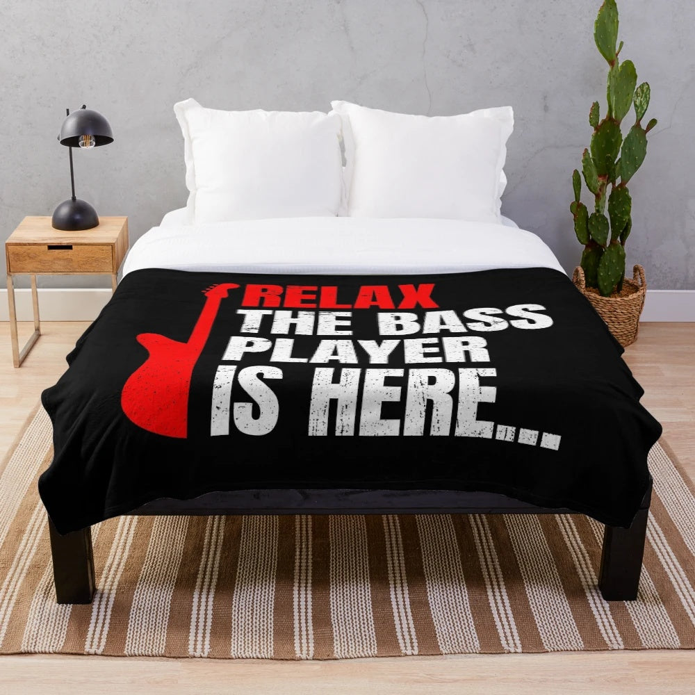 Soft plush blanket featuring a bass player design for music enthusiasts