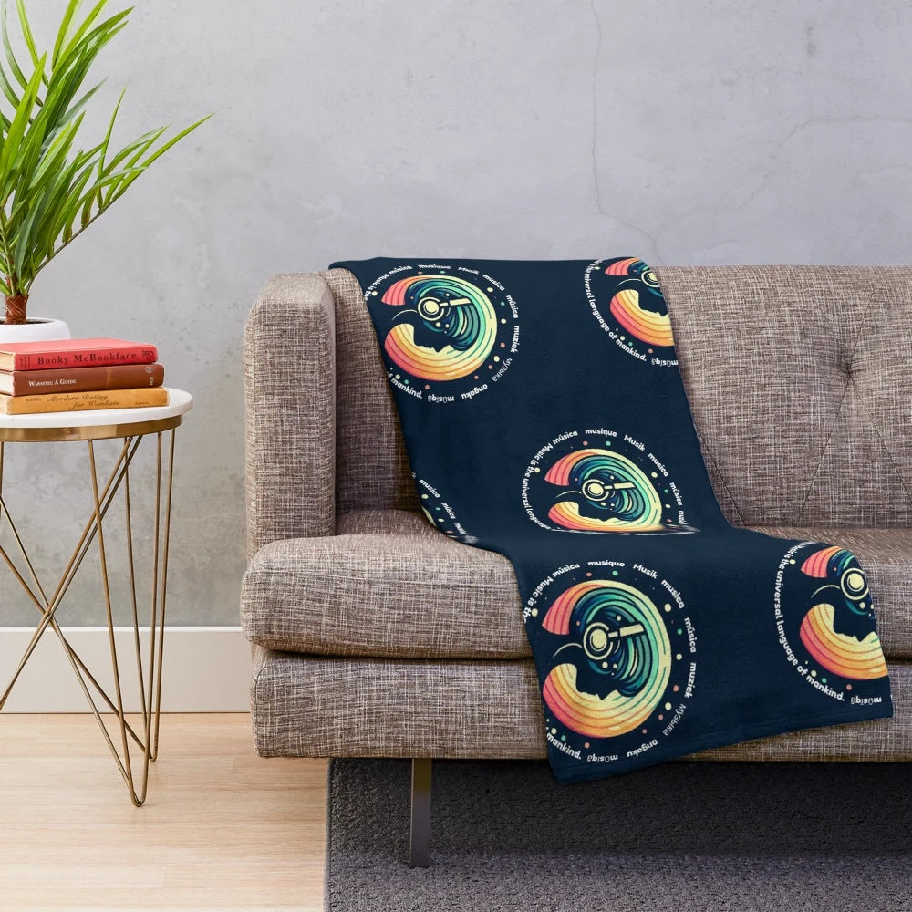 A soft and plush music-themed blanket with a woman wearing headphones