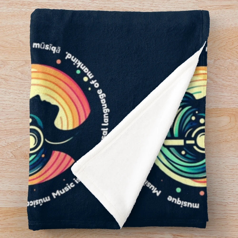 A soft and plush music-themed blanket with a woman wearing headphones