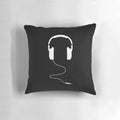Soft, white pillow shaped like a pair of headphones for music lovers.