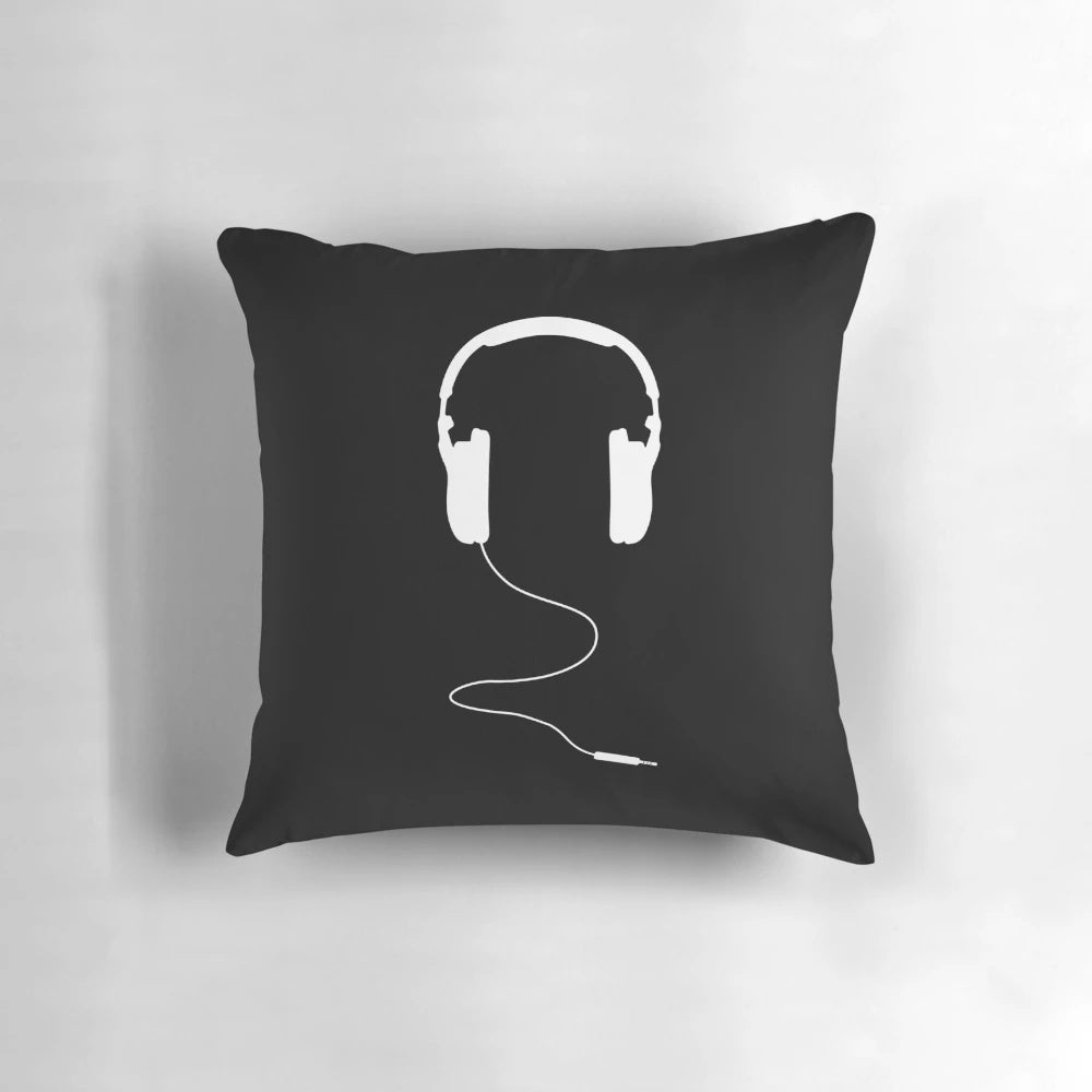 Soft, white pillow shaped like a pair of headphones for music lovers.