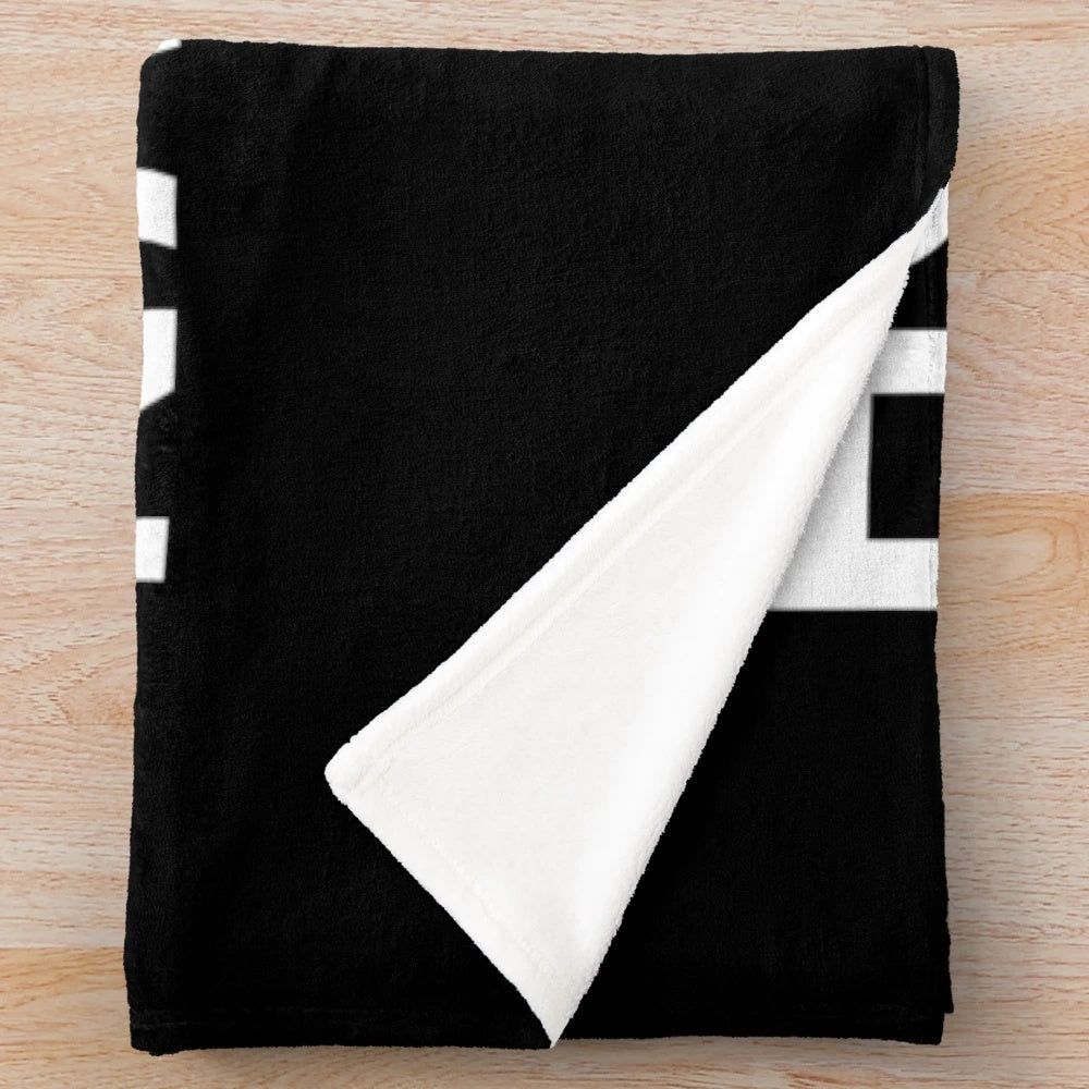 Plush blanket with "Hobbies Include Napping" design