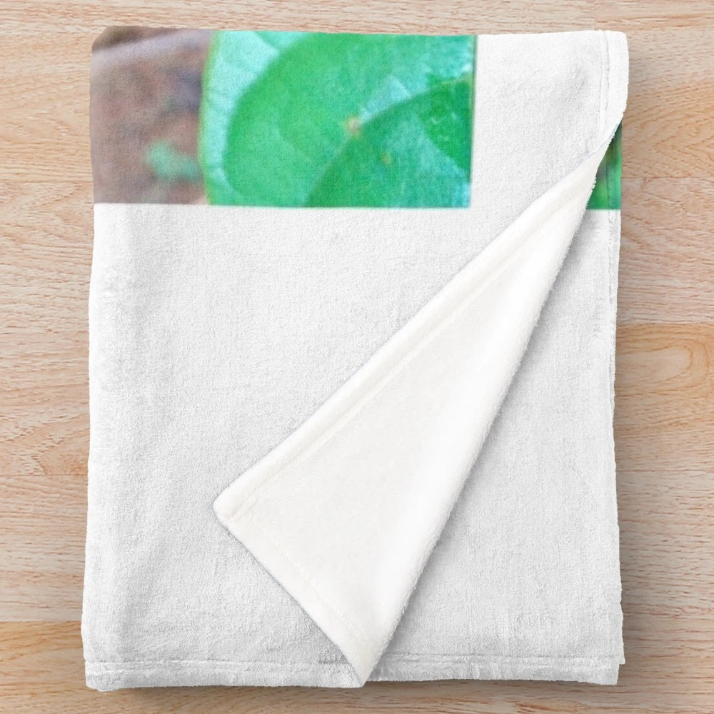 Natural leaf plush blanket with tropical and botanical design