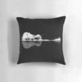 A beautiful, nature-inspired guitar-shaped pillow featuring a silhouetted landscape with trees, water, and birds.