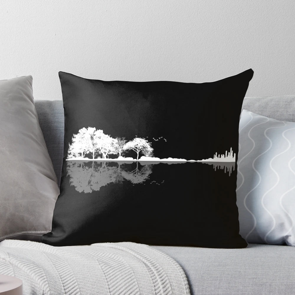 A beautiful, nature-inspired guitar-shaped pillow featuring a silhouetted landscape with trees, water, and birds.