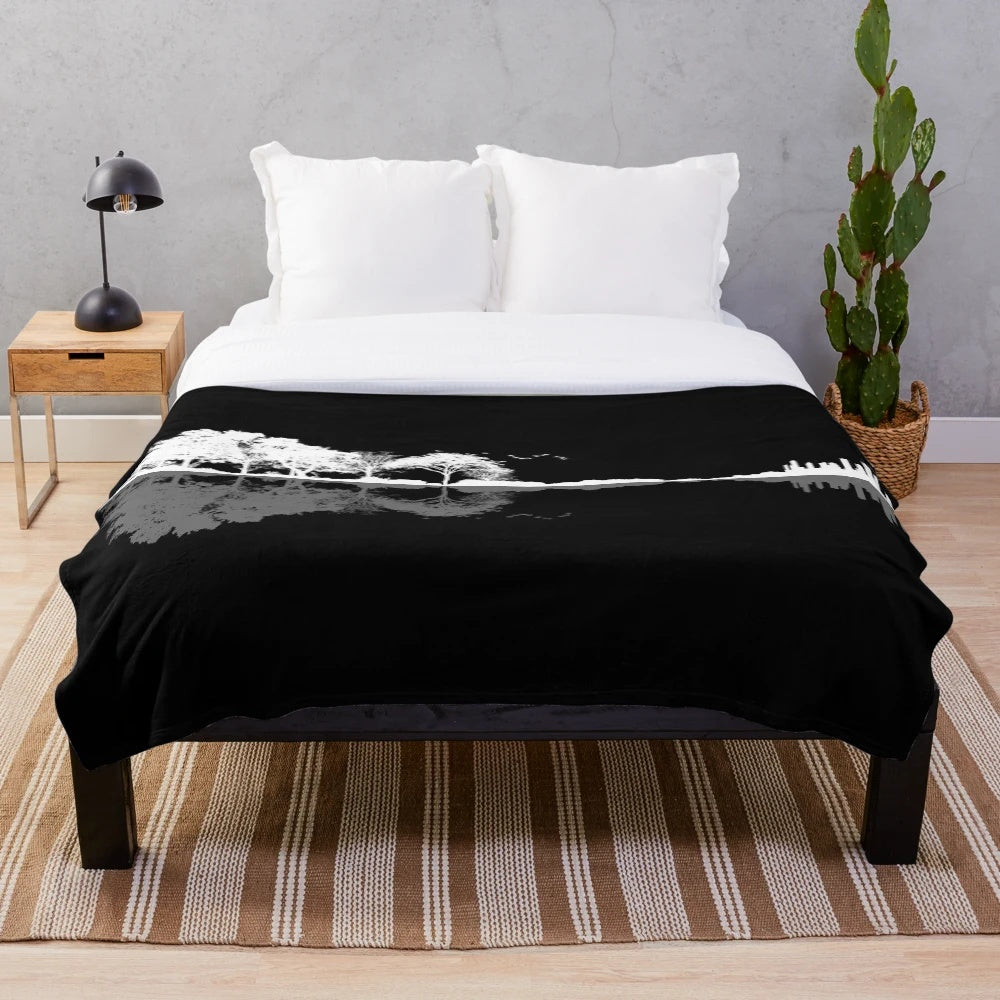 Plush blanket featuring a nature-inspired guitar silhouette design