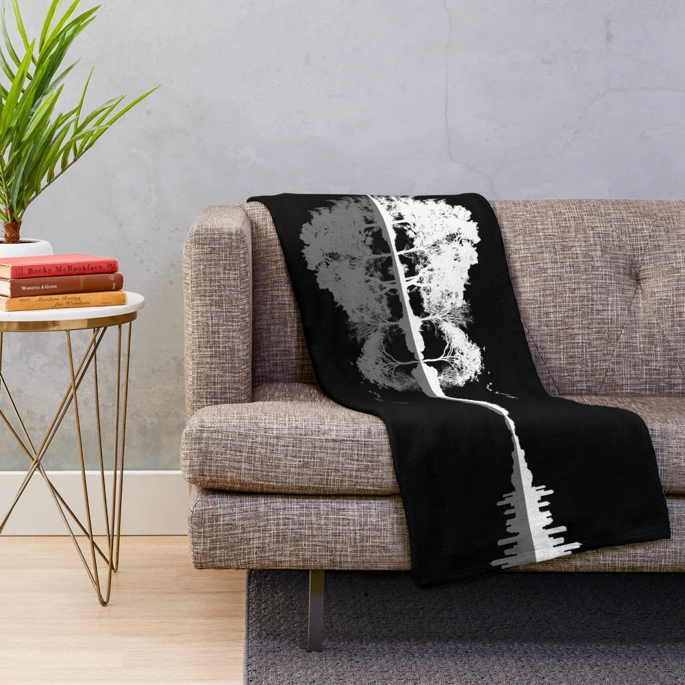 Plush blanket featuring a nature-inspired guitar silhouette design
