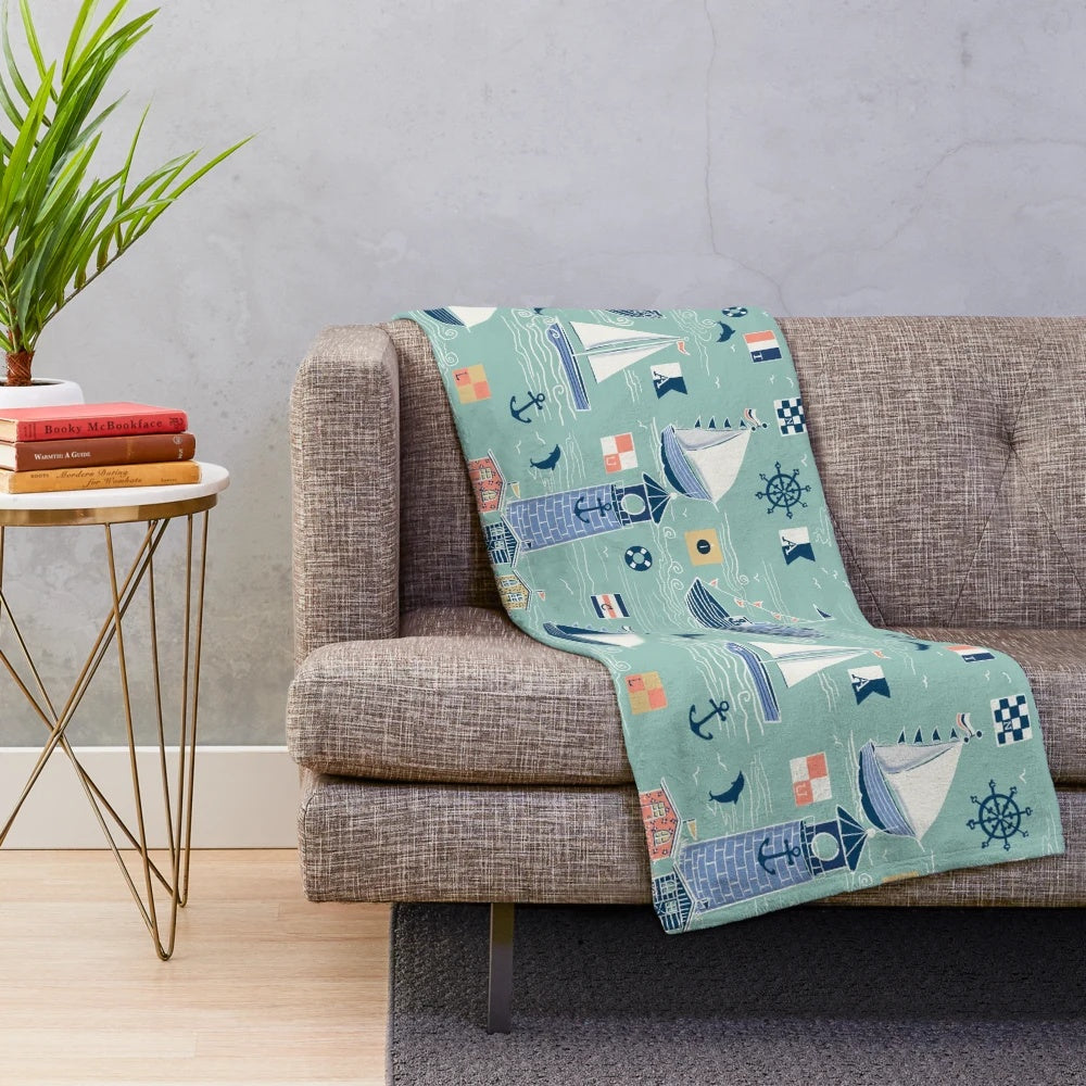 Mint green nautical plush blanket with sailing and coastal design elements