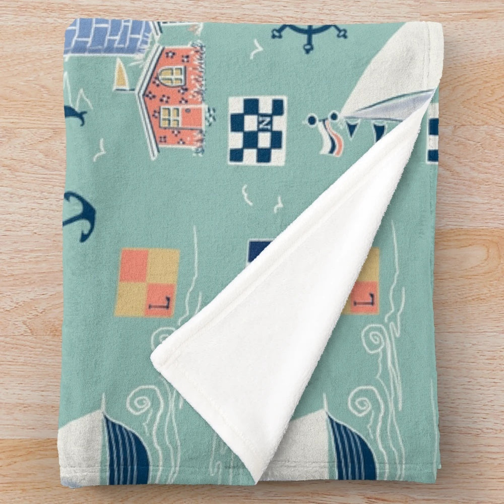 Mint green nautical plush blanket with sailing and coastal design elements