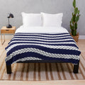Nautical plush blanket with navy and white braid pattern