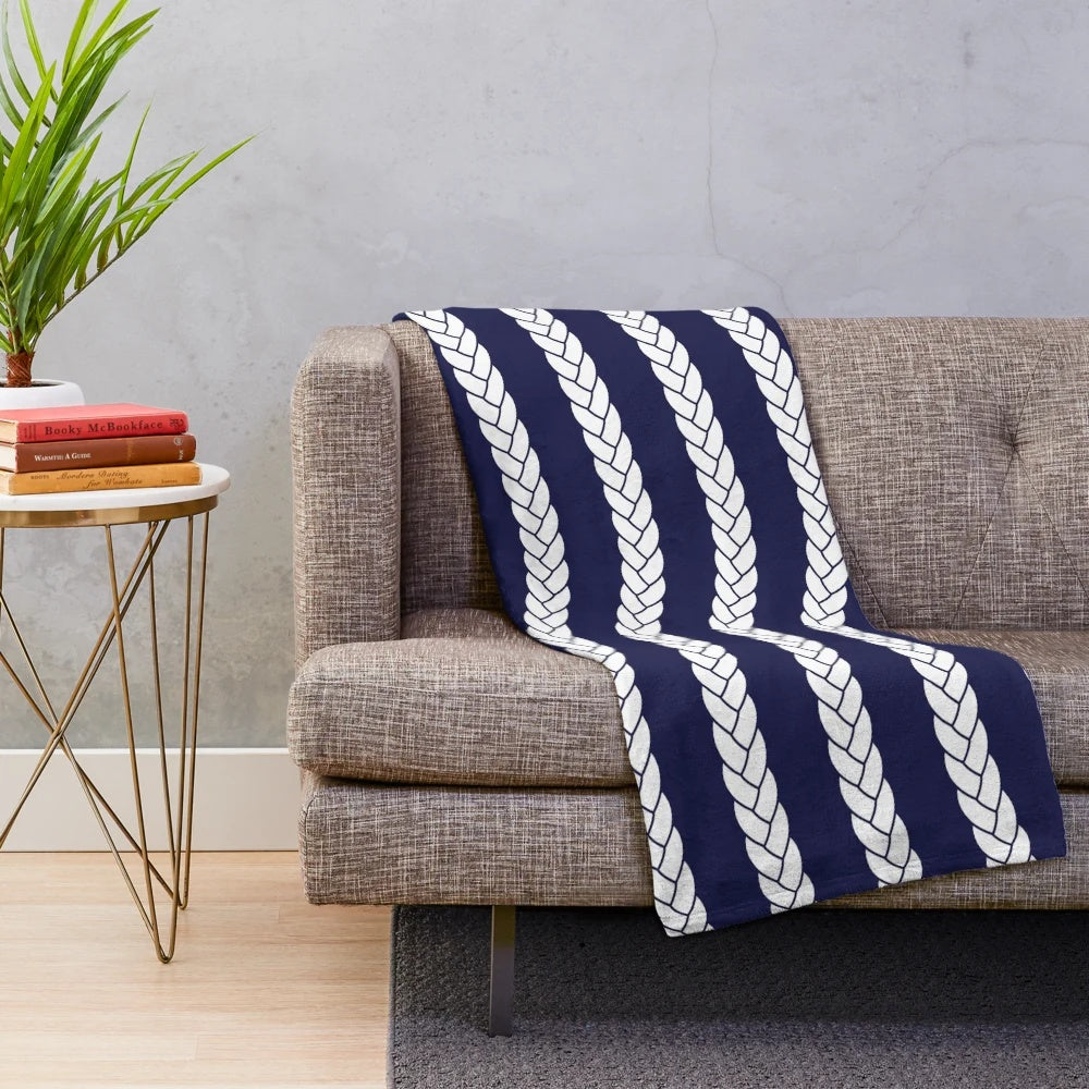 Nautical plush blanket with navy and white braid pattern