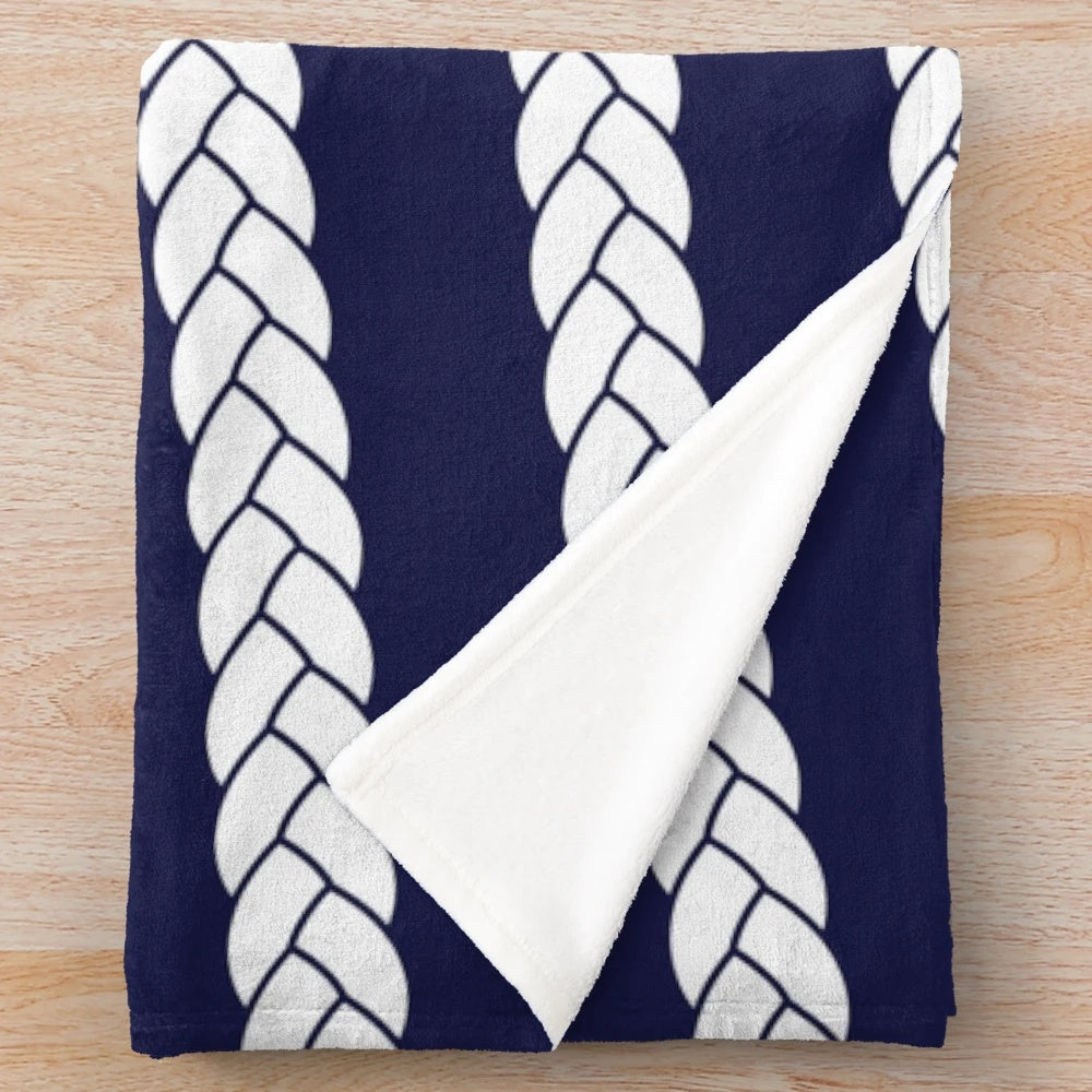 Nautical plush blanket with navy and white braid pattern