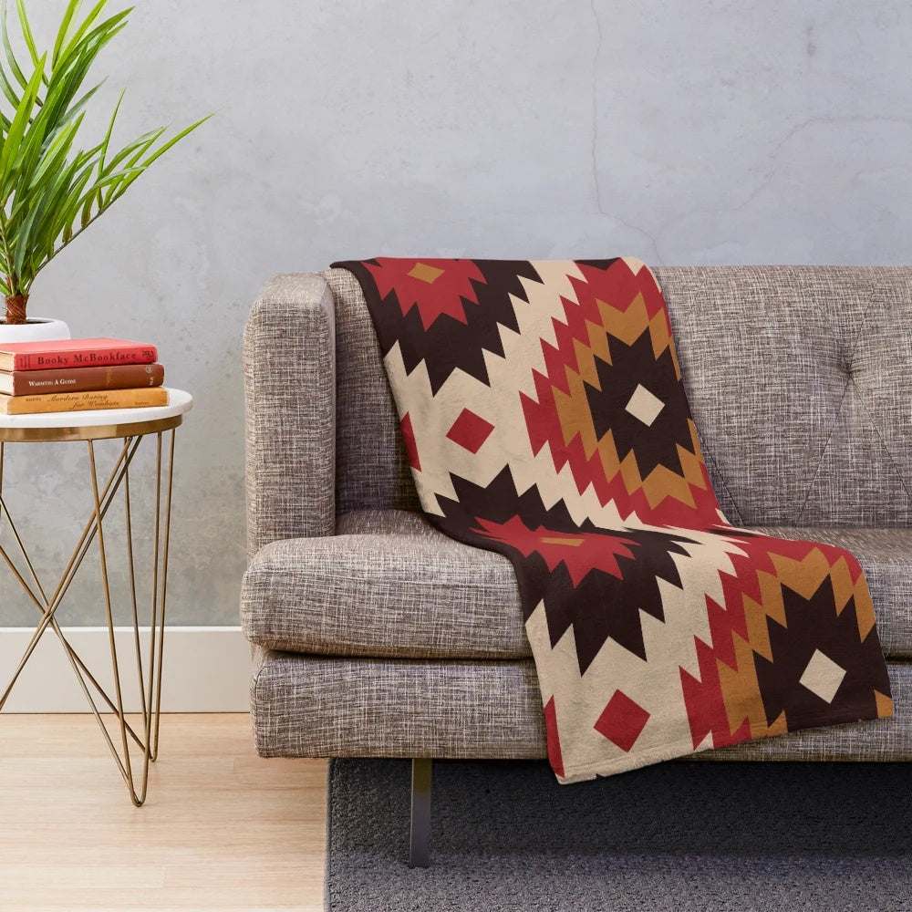 Navajo-inspired plush blanket with red and mustard colors and tribal pattern