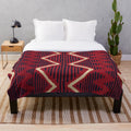 Navajo-inspired plush blanket with geometric patterns in vibrant colors
