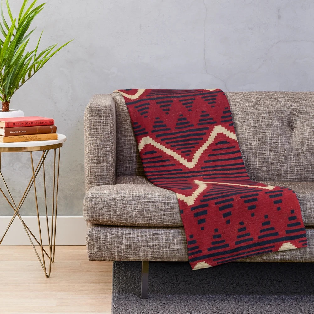 Navajo-inspired plush blanket with geometric patterns in vibrant colors