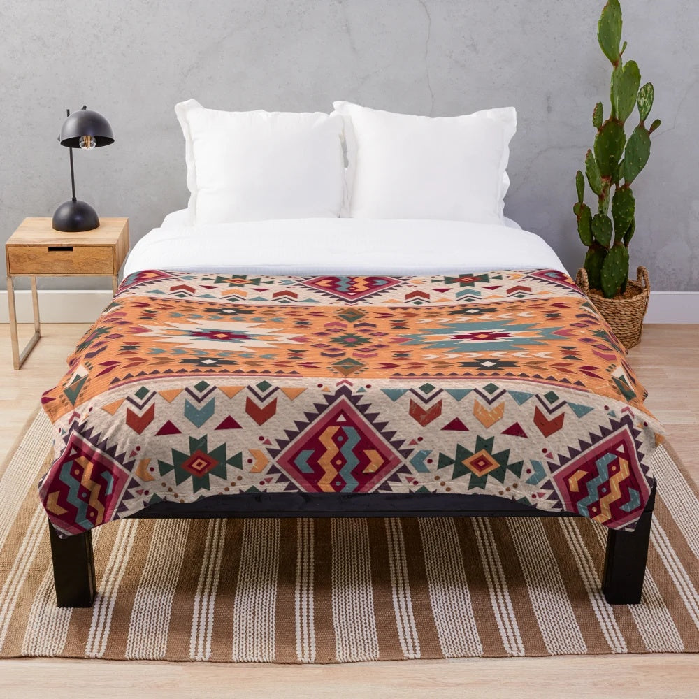 Navajo design plush blanket with geometric tribal pattern