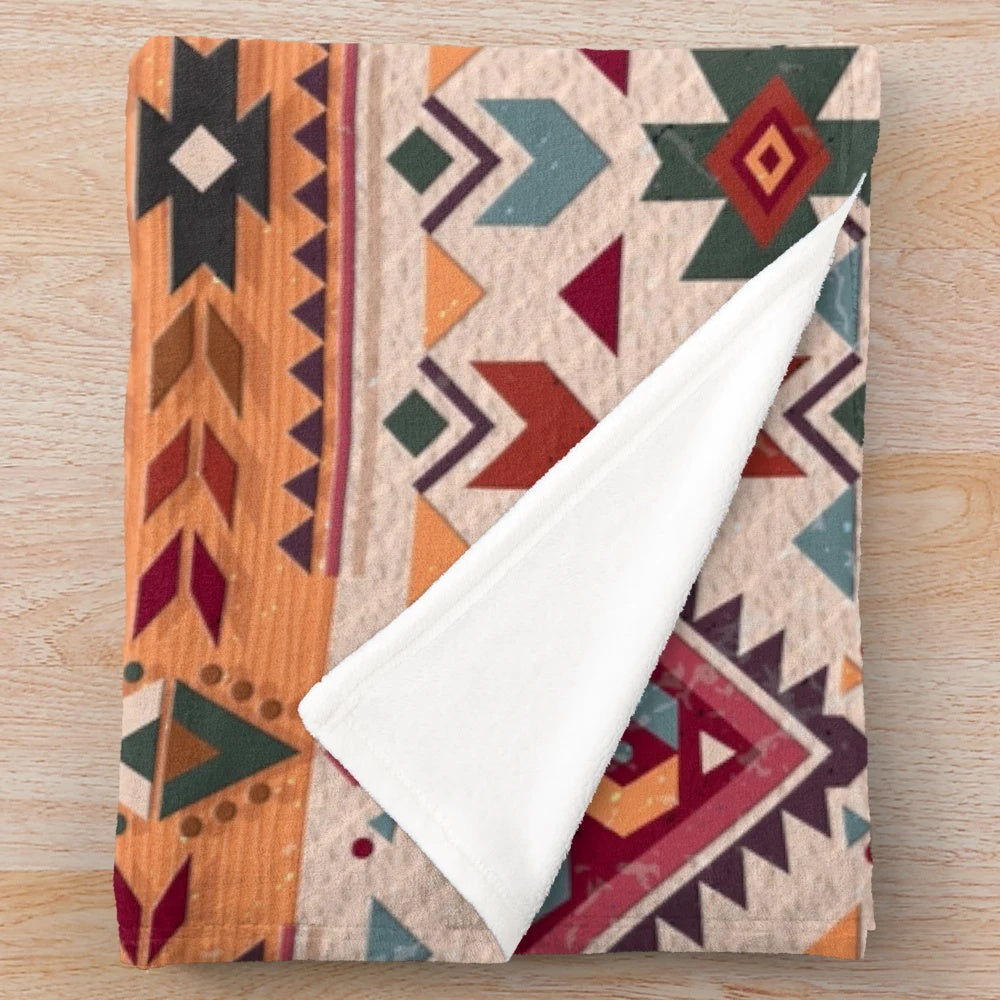 Navajo design plush blanket with geometric tribal pattern