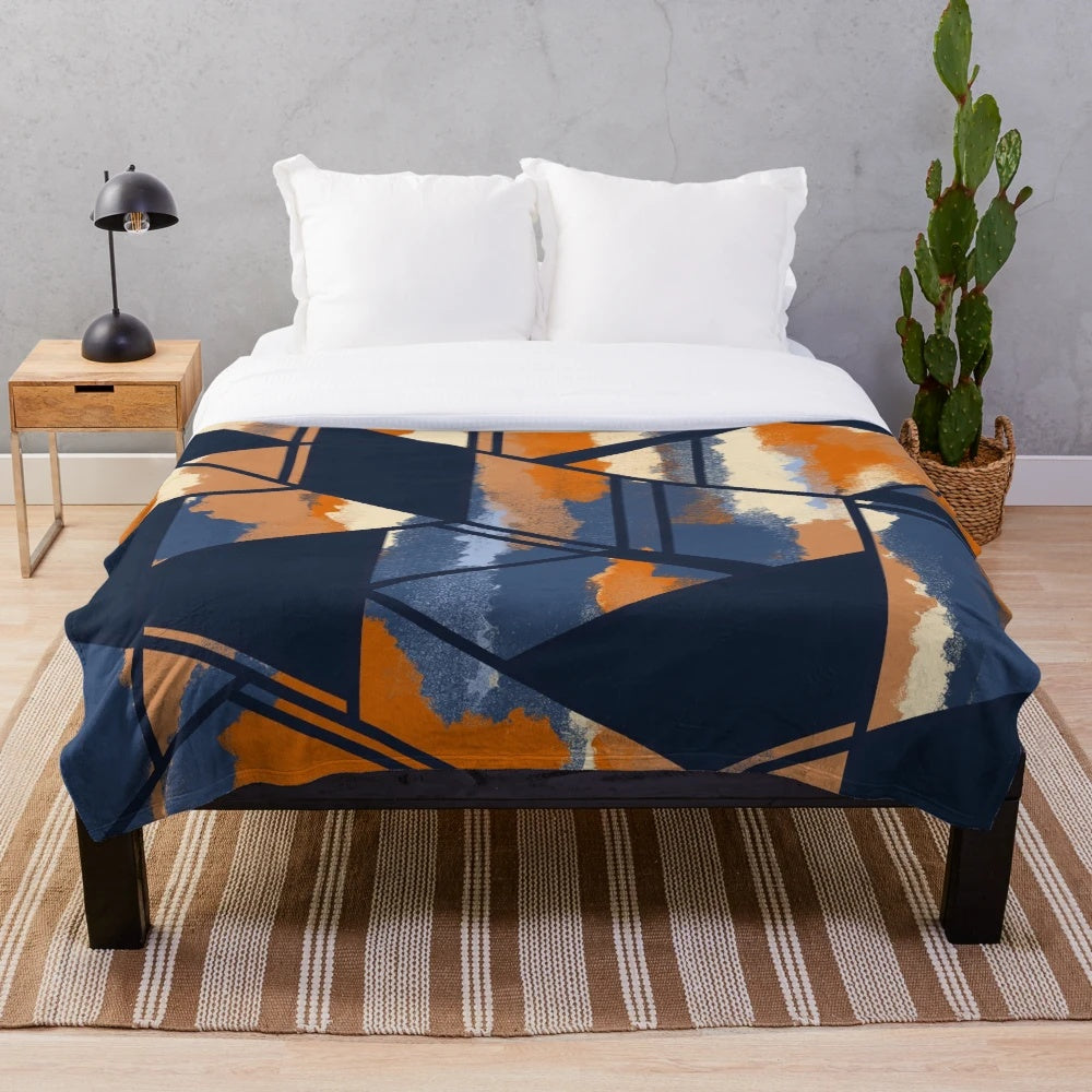 Navy and orange geometric pattern plush blanket