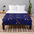 Navy and orange plush blanket with field hockey design