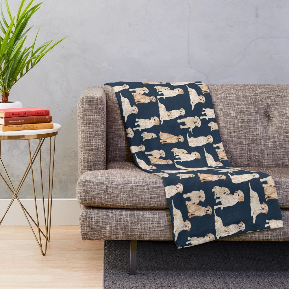 A navy blue plush blanket featuring a cute yellow labrador retriever design