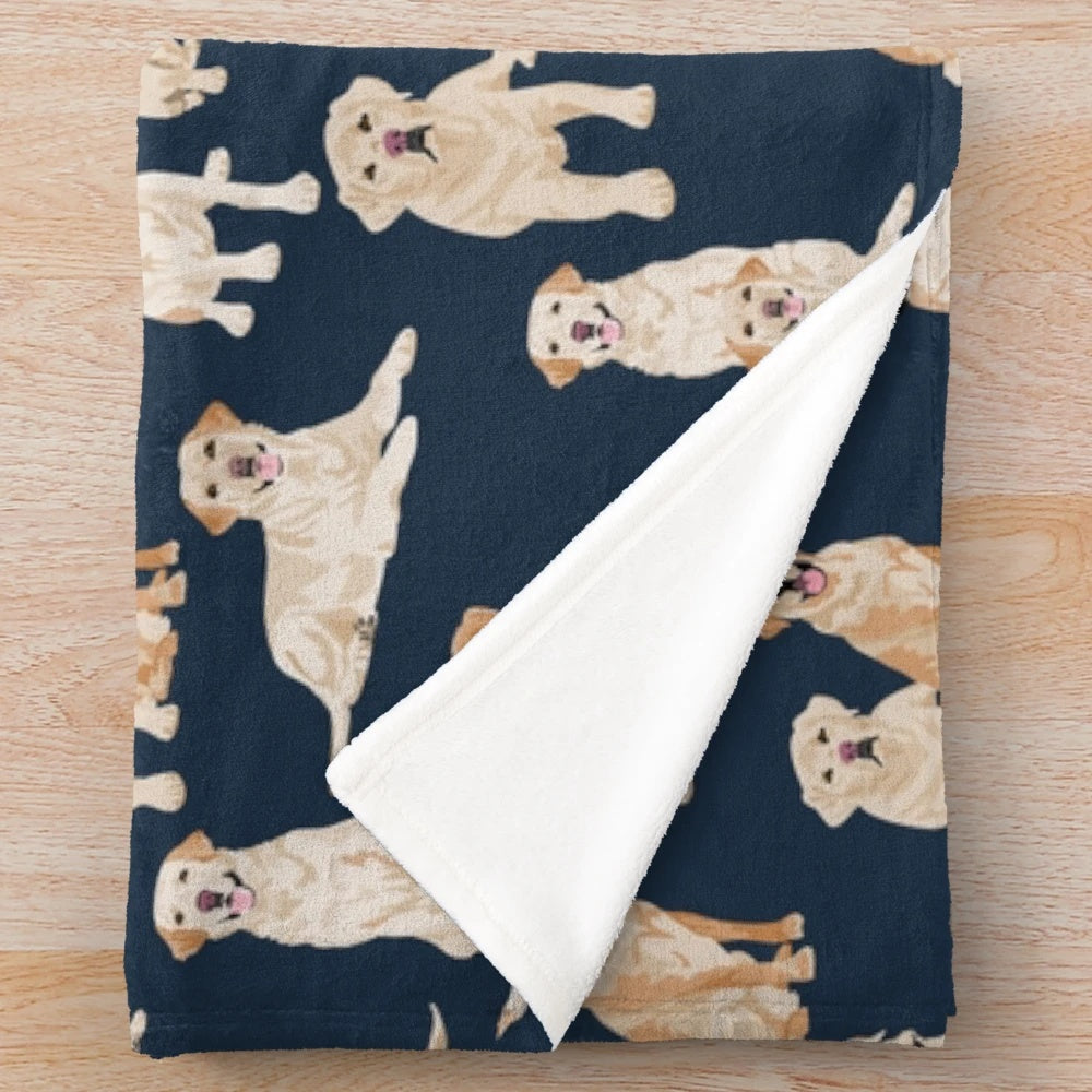 A navy blue plush blanket featuring a cute yellow labrador retriever design