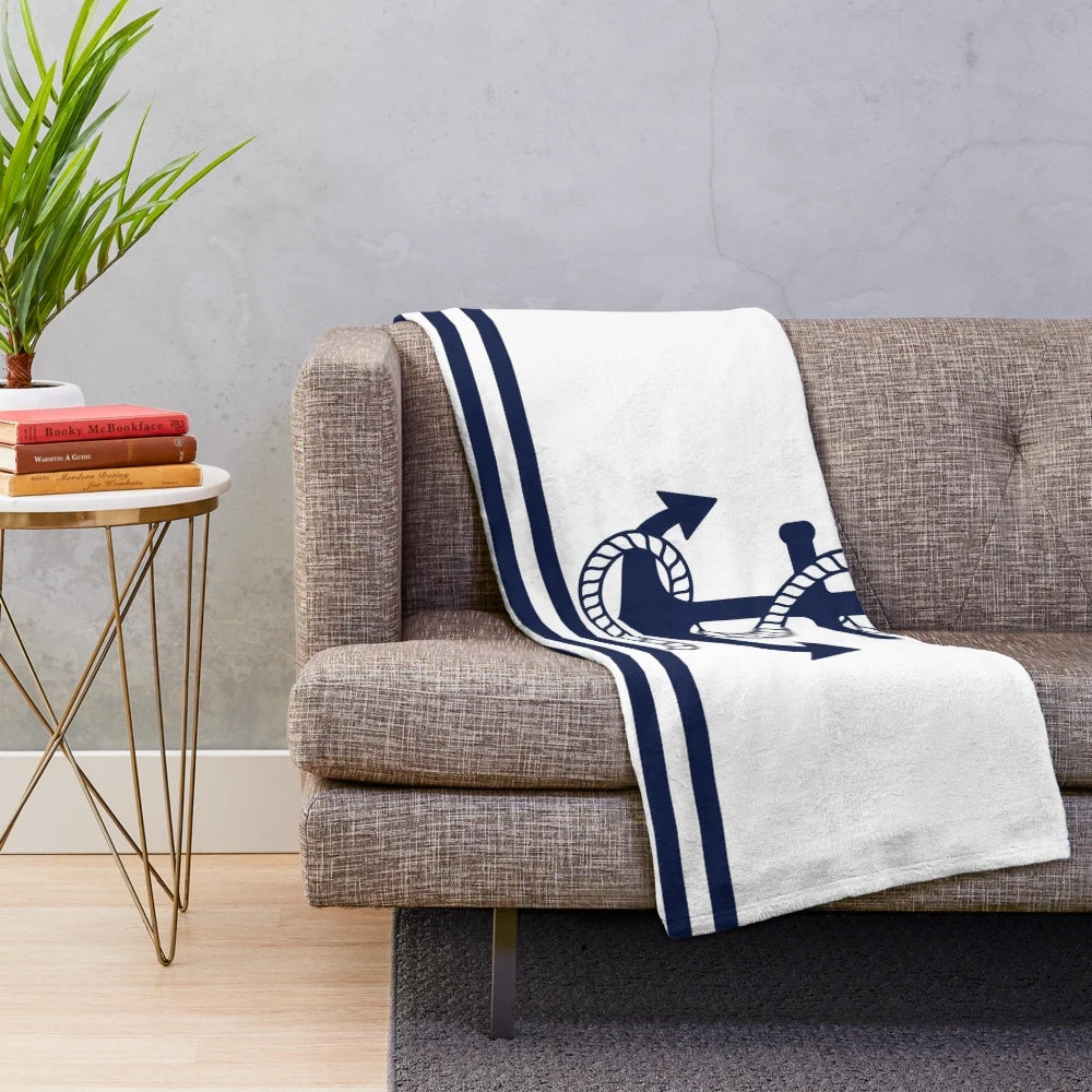 Navy blue and white striped plush blanket with anchor pattern