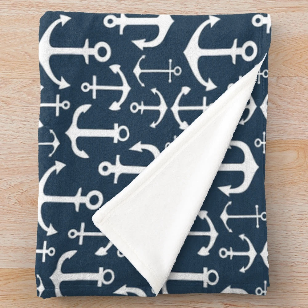 Navy blue plush blanket with anchor pattern