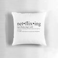 "Cozy pillow with 'netflixing' themed design, perfect for TV show binge-watching"