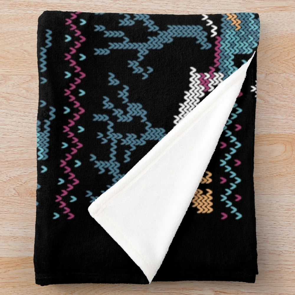 Neverending Story-inspired plush blanket with Falcor and Atreyu design