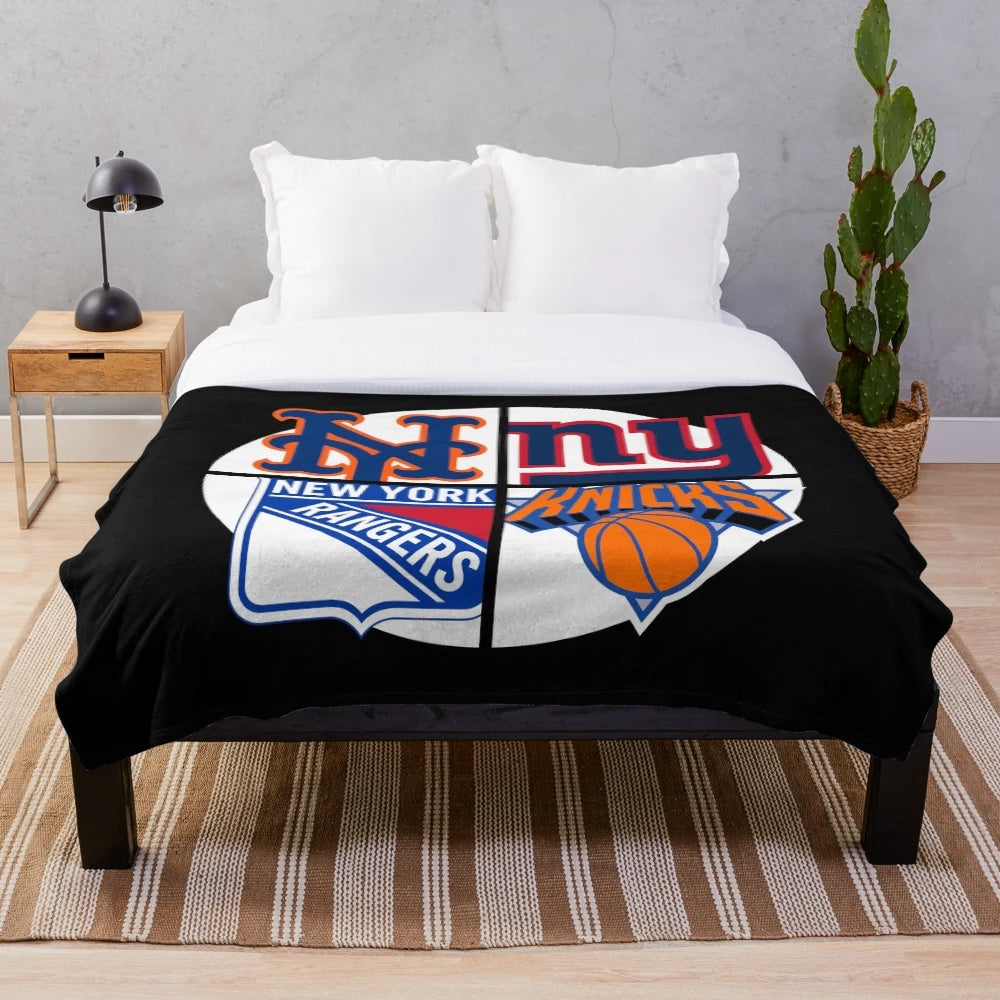 Plush blanket with New York sports team designs