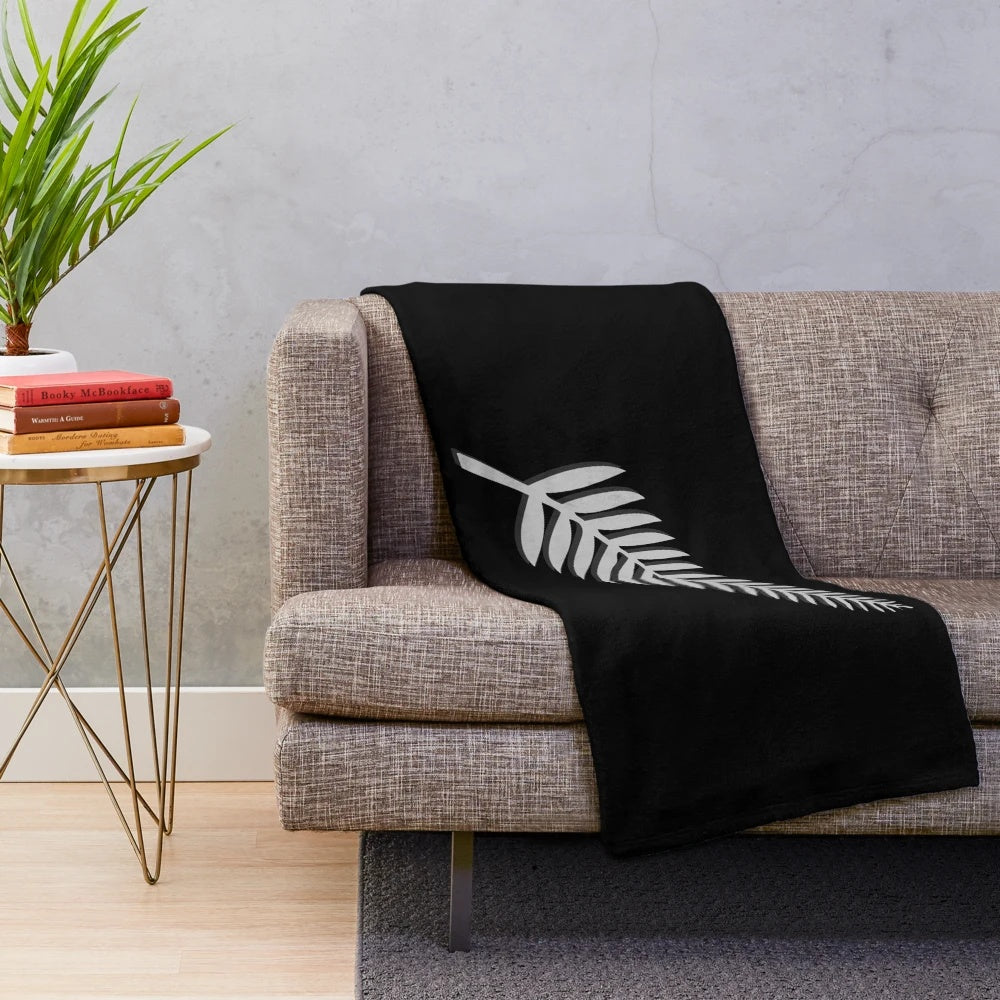 New Zealand inspired plush blanket with kiwi bird and silver fern emblem design