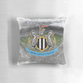 Soft, plush pillow with a newcastle-inspired design for a comfortable sleep experience.