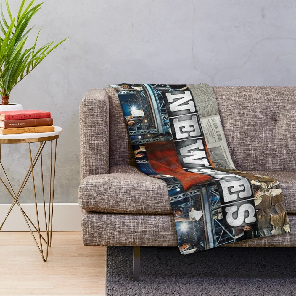 Newsies plush blanket with musical theater collage design