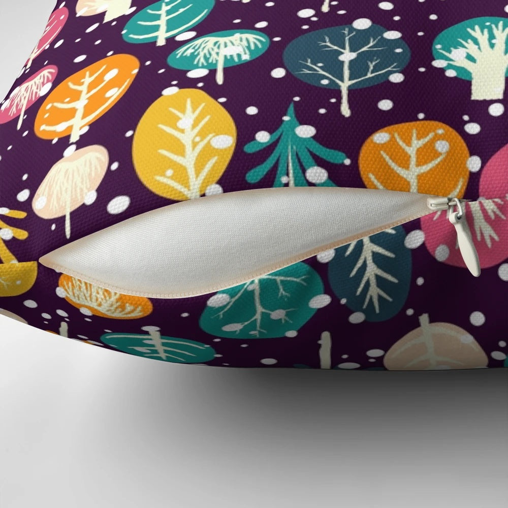 Soft, plush pillow featuring a winter forest scene with fir trees, snow, and snowflakes
