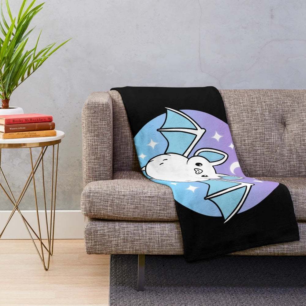Soft and fluffy plush blanket featuring a cute bat design