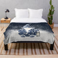 A soft, plush blanket featuring a cute Nordic gnome design with snowflakes