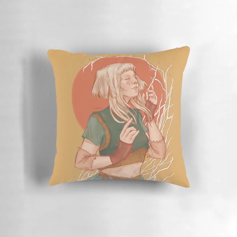 A soft, white pillow featuring a beautiful design of the singer Aurora Aksnes against a nature-inspired backdrop.