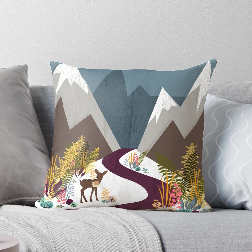 Cozy November pillow with a beautiful winter landscape design, featuring mountains, a full moon, and a deer in the wilderness.
