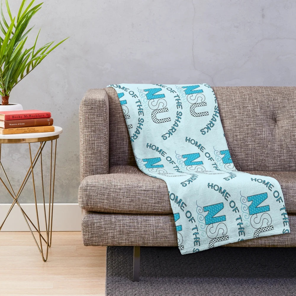 NSU-inspired plush blanket featuring waves, sharks, and polka dots