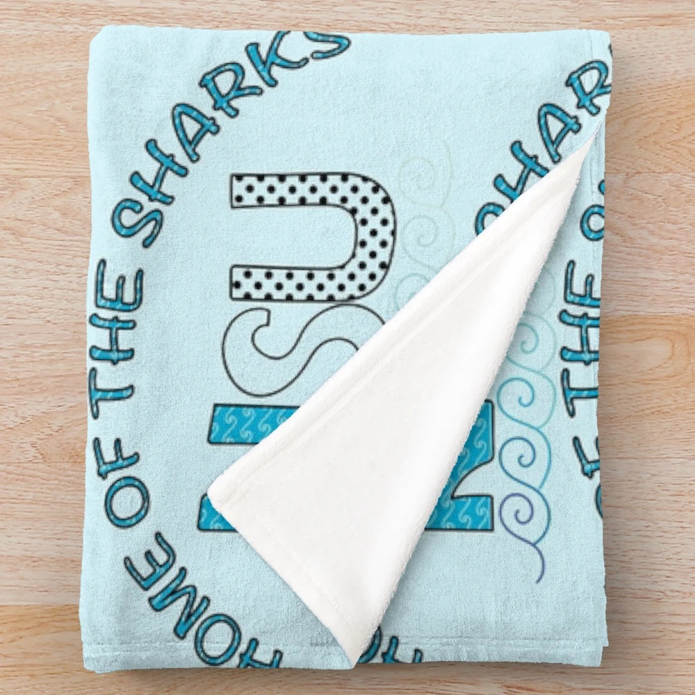 NSU-inspired plush blanket featuring waves, sharks, and polka dots