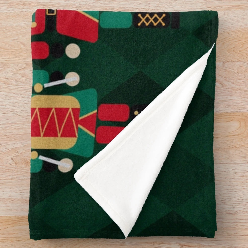 Nutcracker-inspired plush blanket with a diamond pattern design