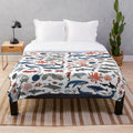 Soft and plush ocean animals blanket featuring a vibrant design by artist Andrea Lauren