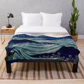 Ocean sunrise-inspired plush blanket with vibrant colors and abstract landscape design